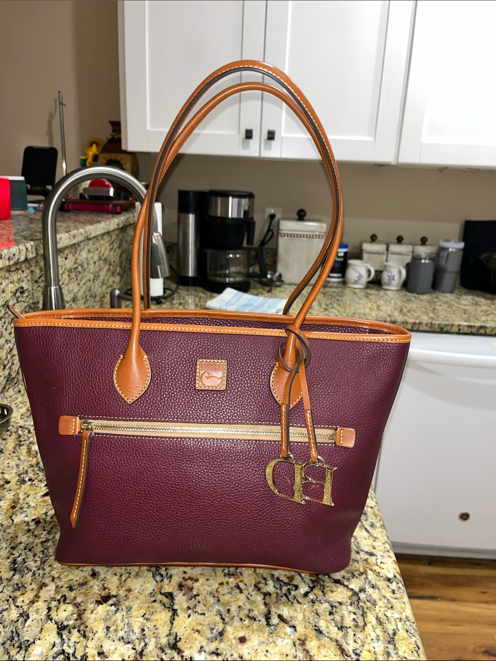 Dooney&Bourke pebbled leather in plum or bordeaux in color handbag